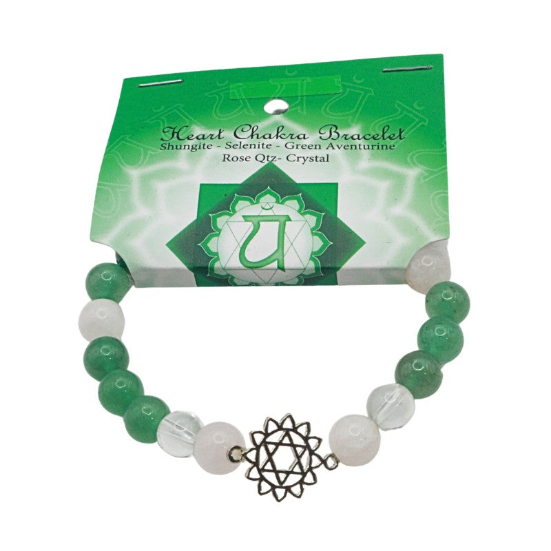 Green and white beaded bracelet with a star-like charm on a green packaging background