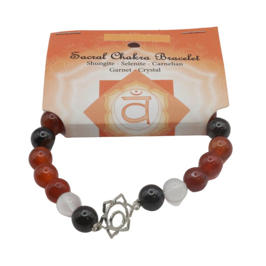 Sacral Chakra bracelet with beads and a silver charm on a white background
