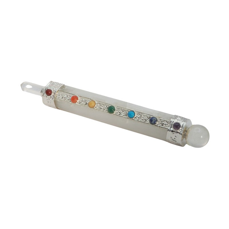 selenite crystal wand with chakra coloured stones on a white background