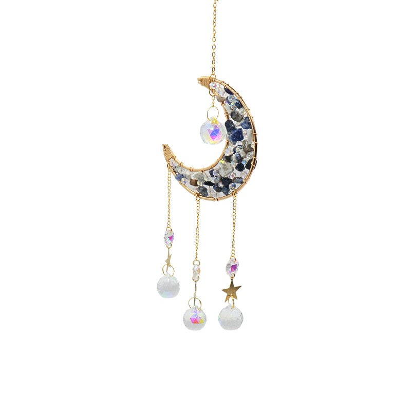 Decorative hanging moon and star ornament with gemstones on a white background