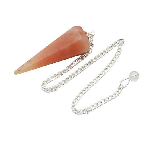 Carnelian crystal pendulum on a white background