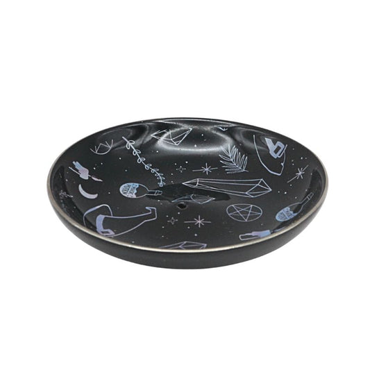 Black ceramic plate with witchy symbols  on a white background
