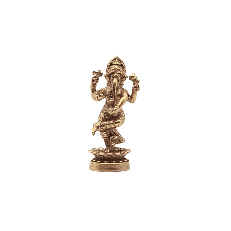 Brass statue of the deity ganesh on a white background