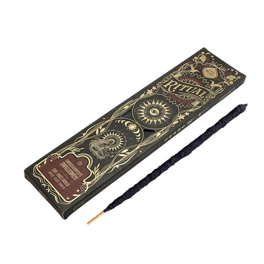 incense stick next to a box of Empowerment Ritual Incense Sticks by Sagrada Madre