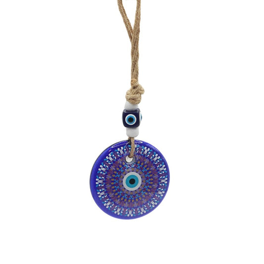 wall hanging with a blue evil eye pendant on a white background