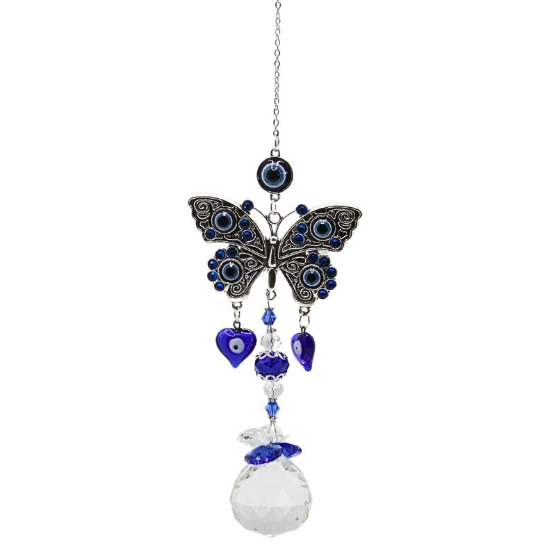 silver coloured metal butterfly hanging from a silver coloured chain and crystal teardrop suncatcher beneath- The butterfly has blue, black and white eye designs in the wings and the suncatcher has blue and clear beads above