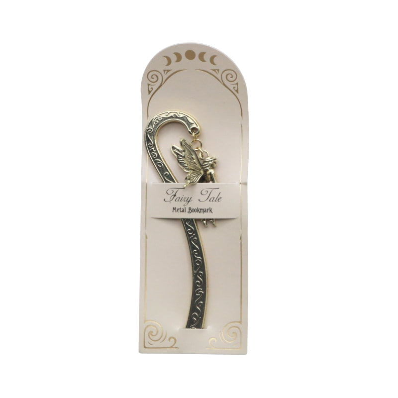 Gold metal bookmark with swirl decorations and a fairy charm at the top, on a cream bookmark card with words "Fairy Tale Metal Bookmark" on a  white background