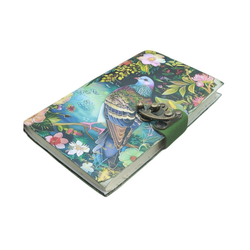 front cover of journal with locking closure and an image of a bird and floral design, on a white background