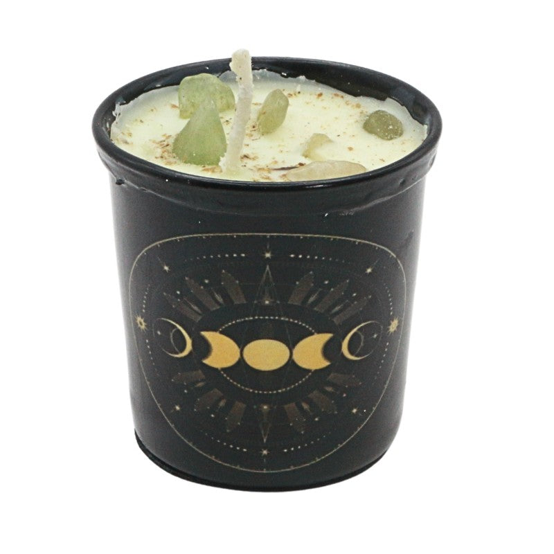 Candle in a black container with gold moon phases design on a white background