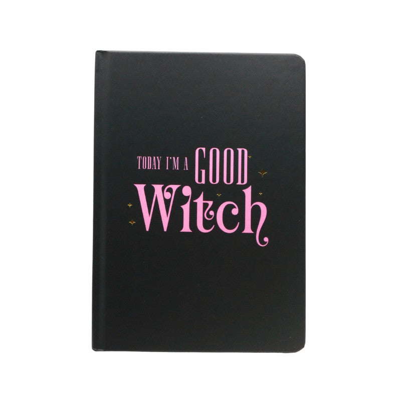 Black notebook with pink text 'Today I'm a Good Witch' on a white background