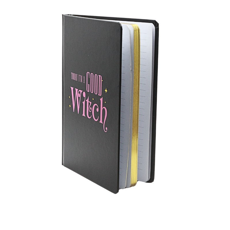 Black notebook with 'Good Witch' text on a white background