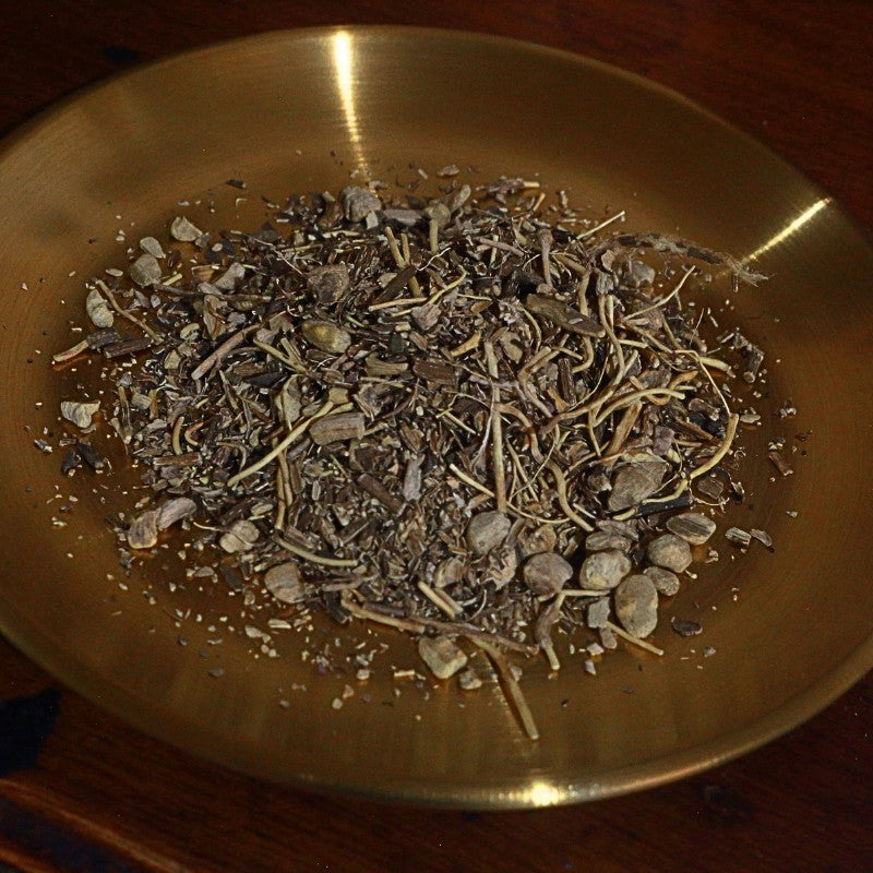 Dry gravel root  on a brass plate