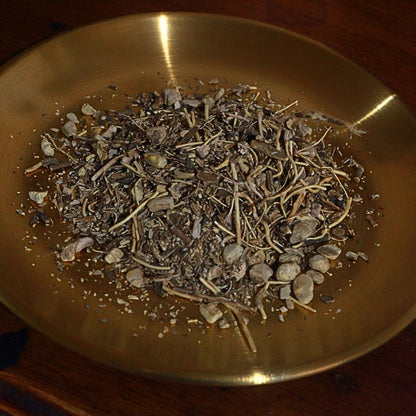 Dry gravel root  on a brass plate