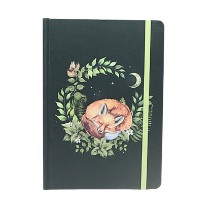 Notebook with a fox illustration on a black background