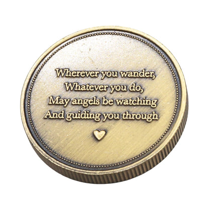 A round bronze-colored guardian angel protection coin with a quote and heart