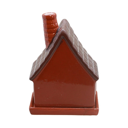 A small decorative house-shaped ceramic container or figurine with a red body, brown roof on a plain white background.