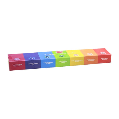A long rectangular box of HEM 7 Chakra Tealight Candles, showing a colourful side panel with six distinct coloured segments representing the chakras, set against a plain white background.