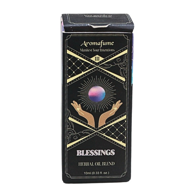 A rectangular black box labeled 'Aromafume Blessings Herbal Oil Blend' with gold decorative lines, a crystal ball illustration, and two raised hands, shown on a plain white background.