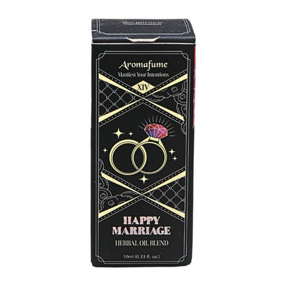 A rectangular black box for 'Aromafume Happy Marriage HEBBAI OIL BLEND' featuring gold decorative borders, interlocking rings, and a pink diamond illustration on a white background.