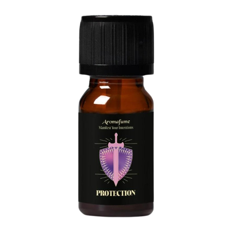 A small amber glass bottle with a black ribbed cap and a black label. The label features a purple and pink shield graphic with a crown and the text 'Aromafume' and 'PROTECTION'.