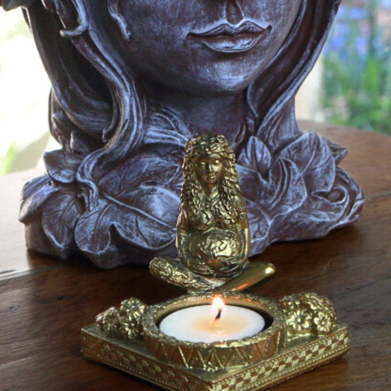 Mother Earth Goddess Tealight Candle Holder in front of a goddess plant holder