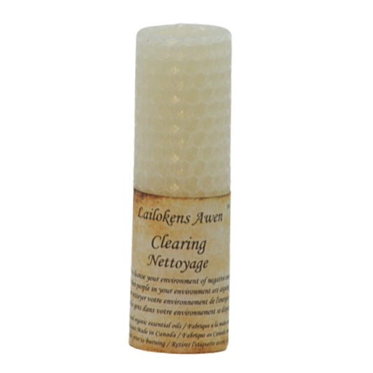 white beeswax rolled candle with a distressed label