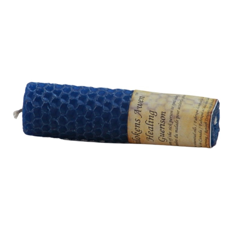 blue beeswax rolled candle with a distressed label