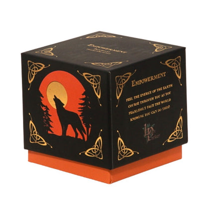 candle gift box-black with orange and gold- featuring a wolf on front with the word "empowerment" written in gold on top.