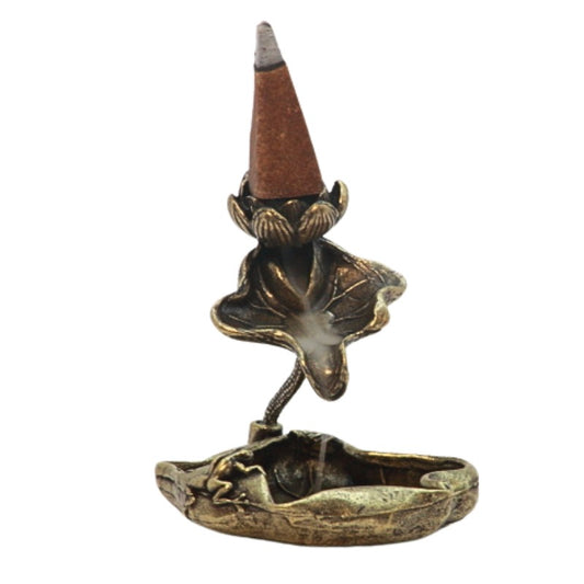 Backflow incense cone on a gold lotus backflow incense burner