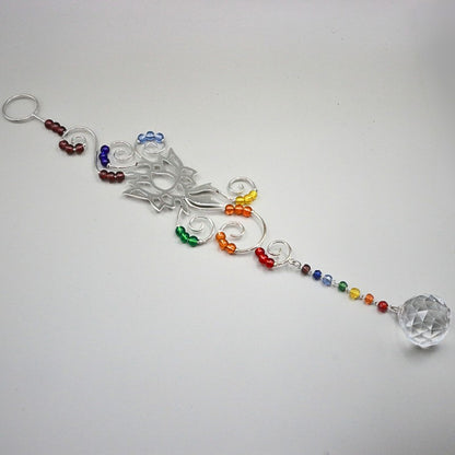 decorative hanging ornament with coloured beads on a white background