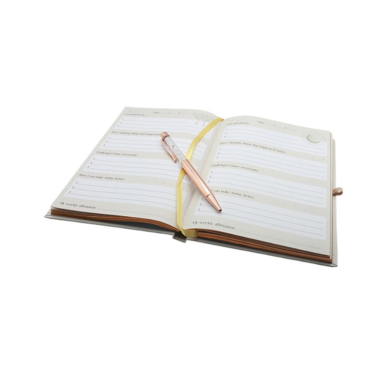 Open notebook with a pen on a white background