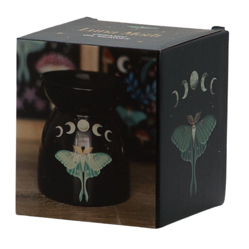 box showing Black oil burner with a green lunar moth and the phases of the moon printed on it