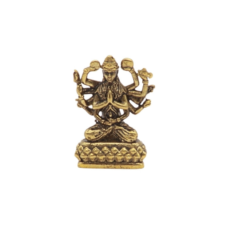 Brass statue of a deity with multiple arms on a white background