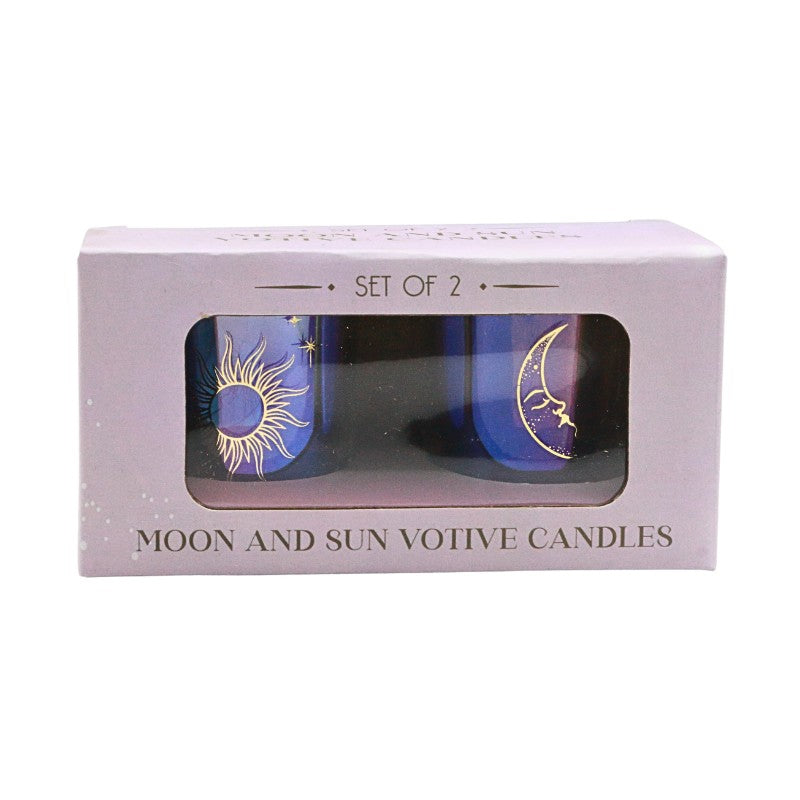 Set of 2 moon and sun votive candles in packaging on a white background