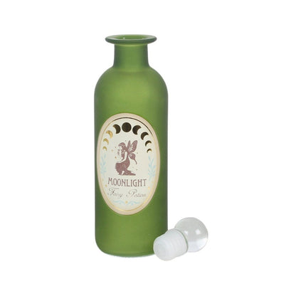 An olive green glass bottle with a white and beige oval label reading 'MOONLIGHT Fairy Potion' and a small fairy illustration, shown with a clear plastic stopper on a white background.