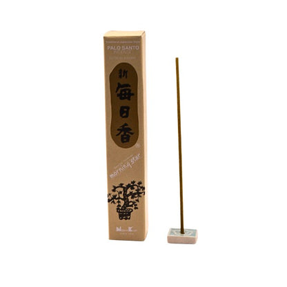 Palo Santo Morning star incense box next to incense stick standing in incense tile