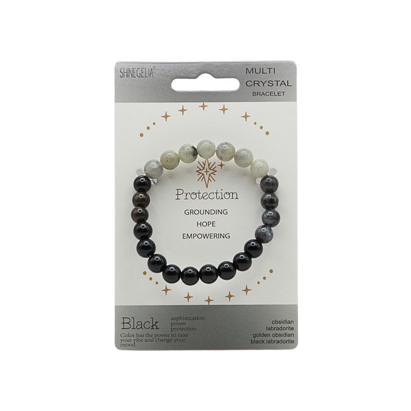 Multi crystal bracelet on card with black and white beads.