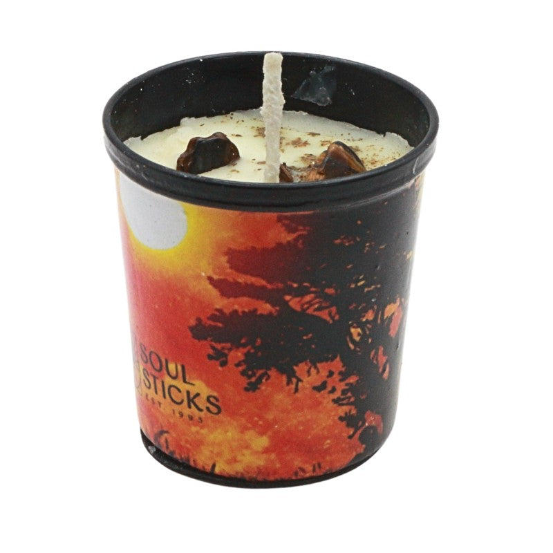 Candle in a container with a sunset design and 'Soul Sticks' branding on a white background.