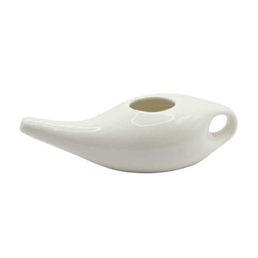 White ceramic neti pot on a white background