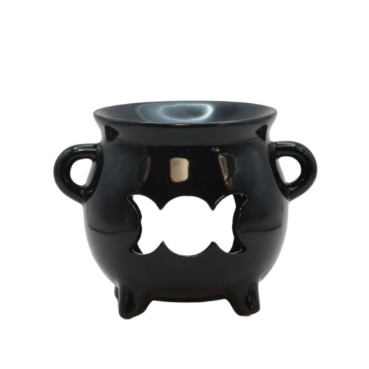 black ceramic cauldron oil burner with a triple moon shape cut out on the front