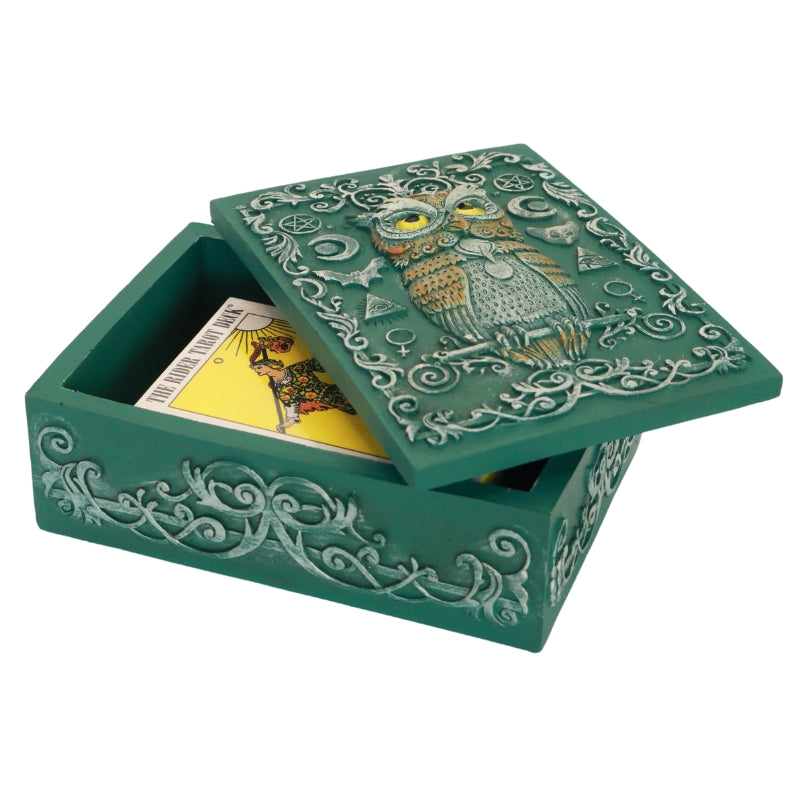 turquoise tarot and jewellery box with an owl and sacred symbols on the lid. Inside it is a pocket rider waite tarot deck. 