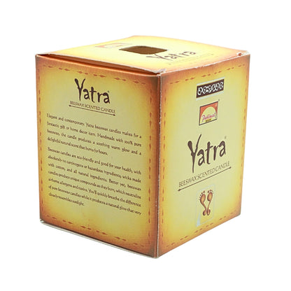 Angled view of the gold Parimal Yatra beeswax candle box showing the branded front and product description panel
