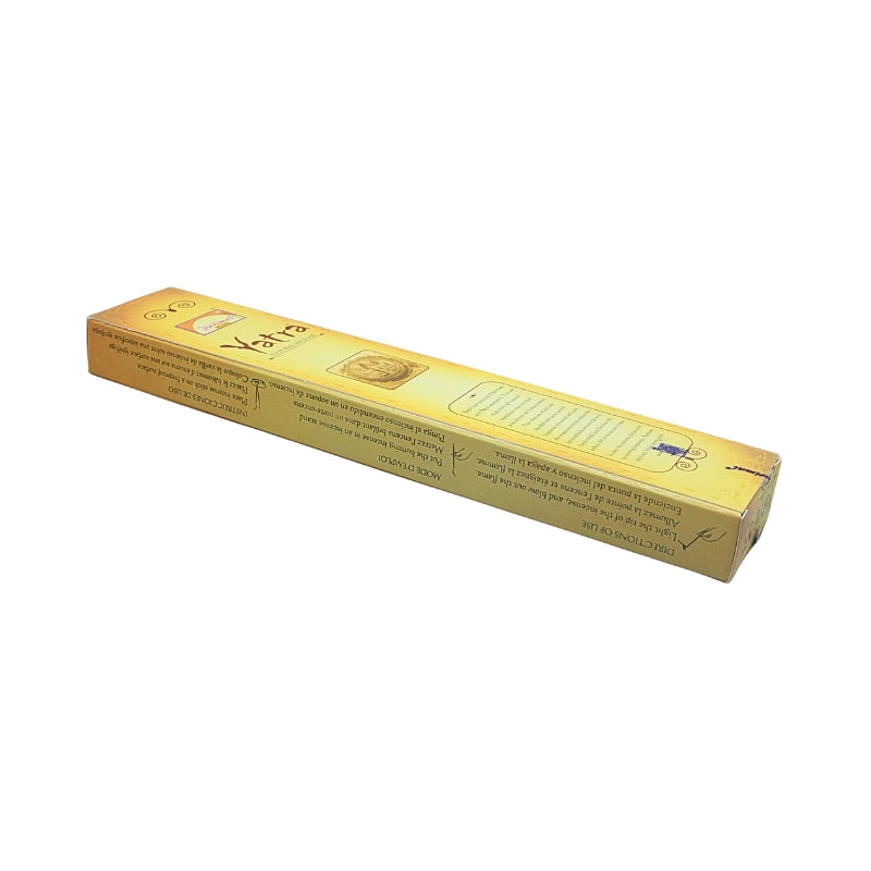 Angled view of the gold Parimal Yatra 15g incense box showing the front and side with usage instructions.
