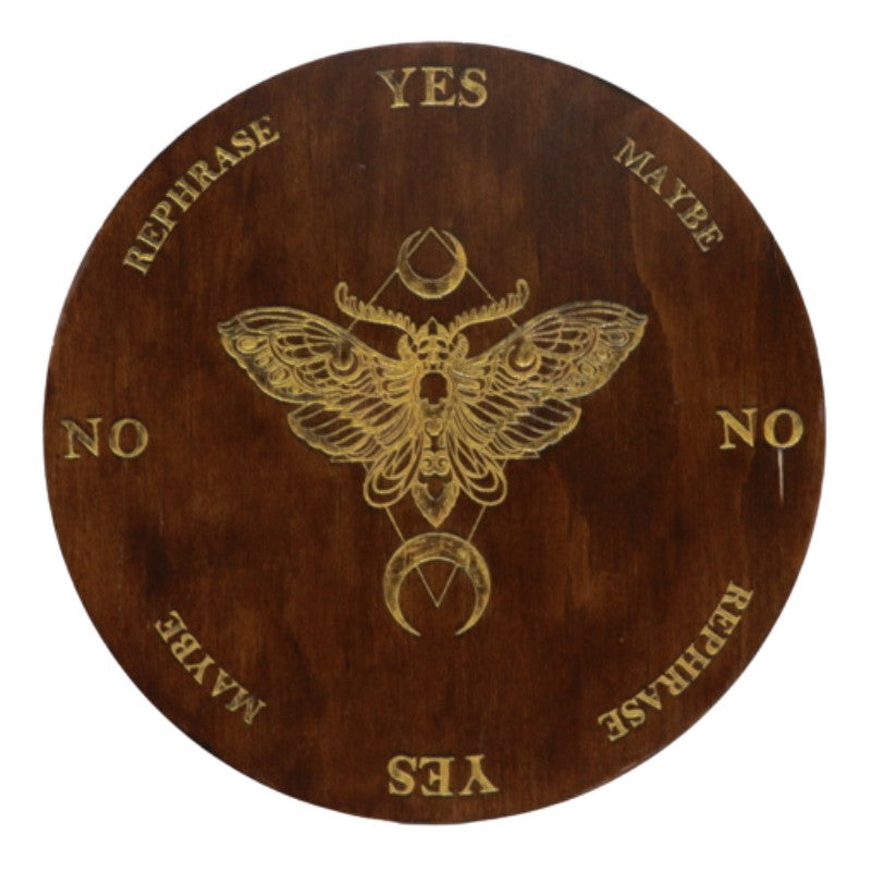 round wooden board with a Death's Head Moth painted in gold in the centre with yes, no answers painted around the edges