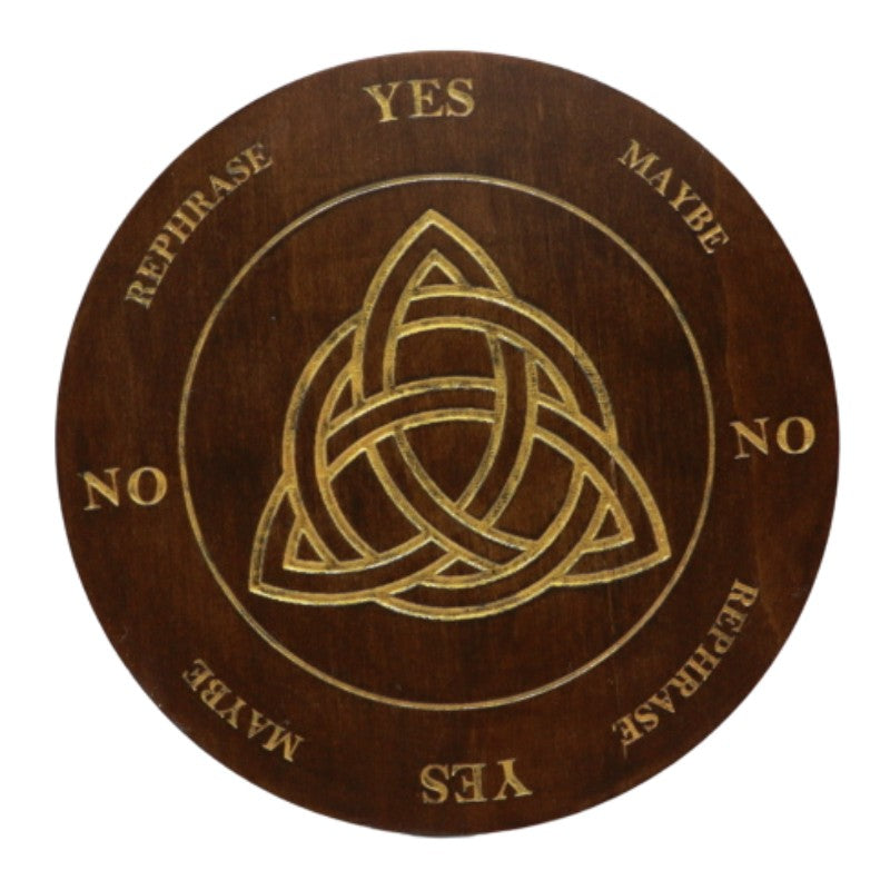 round wooden board with a triquetra painted in gold in the centre with yes, no answers painted around the edges