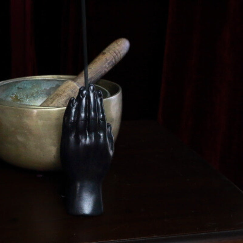 Praying hands Incense Holder in front of singing bowls