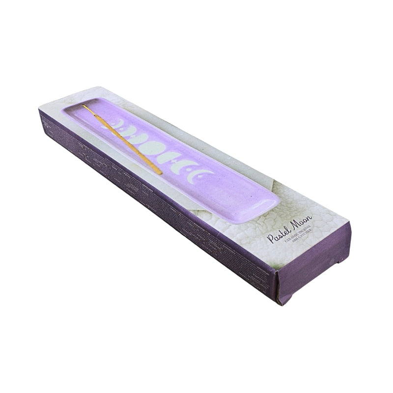 A lavender purple ceamic tray with an incense stick, presented inside its white and purple packaging box on a white background.
