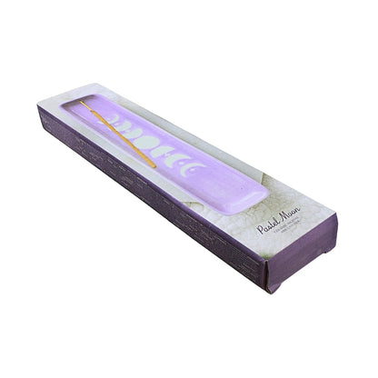 A lavender purple ceamic tray with an incense stick, presented inside its white and purple packaging box on a white background.