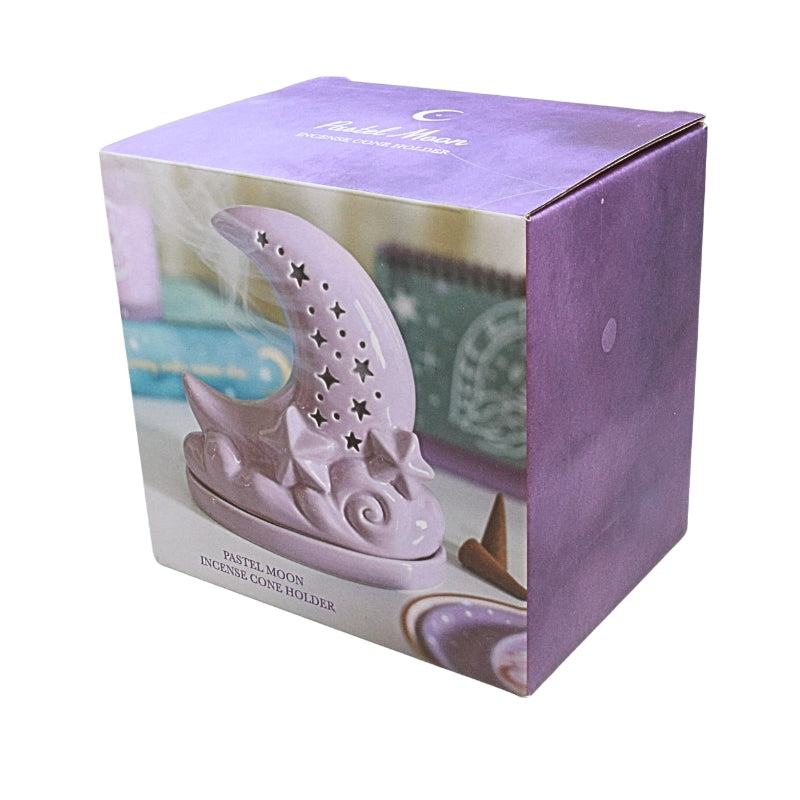 box showing a Purple ceramic moon shaped incense cone burner with star cut outs, on a white background