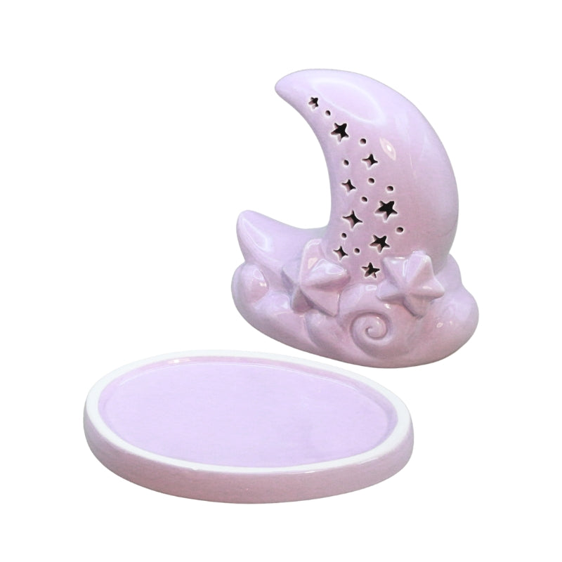 Purple ceramic moon shaped incense cone burner with star cut outs, on a white background